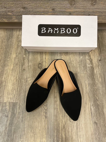 Black flat mules