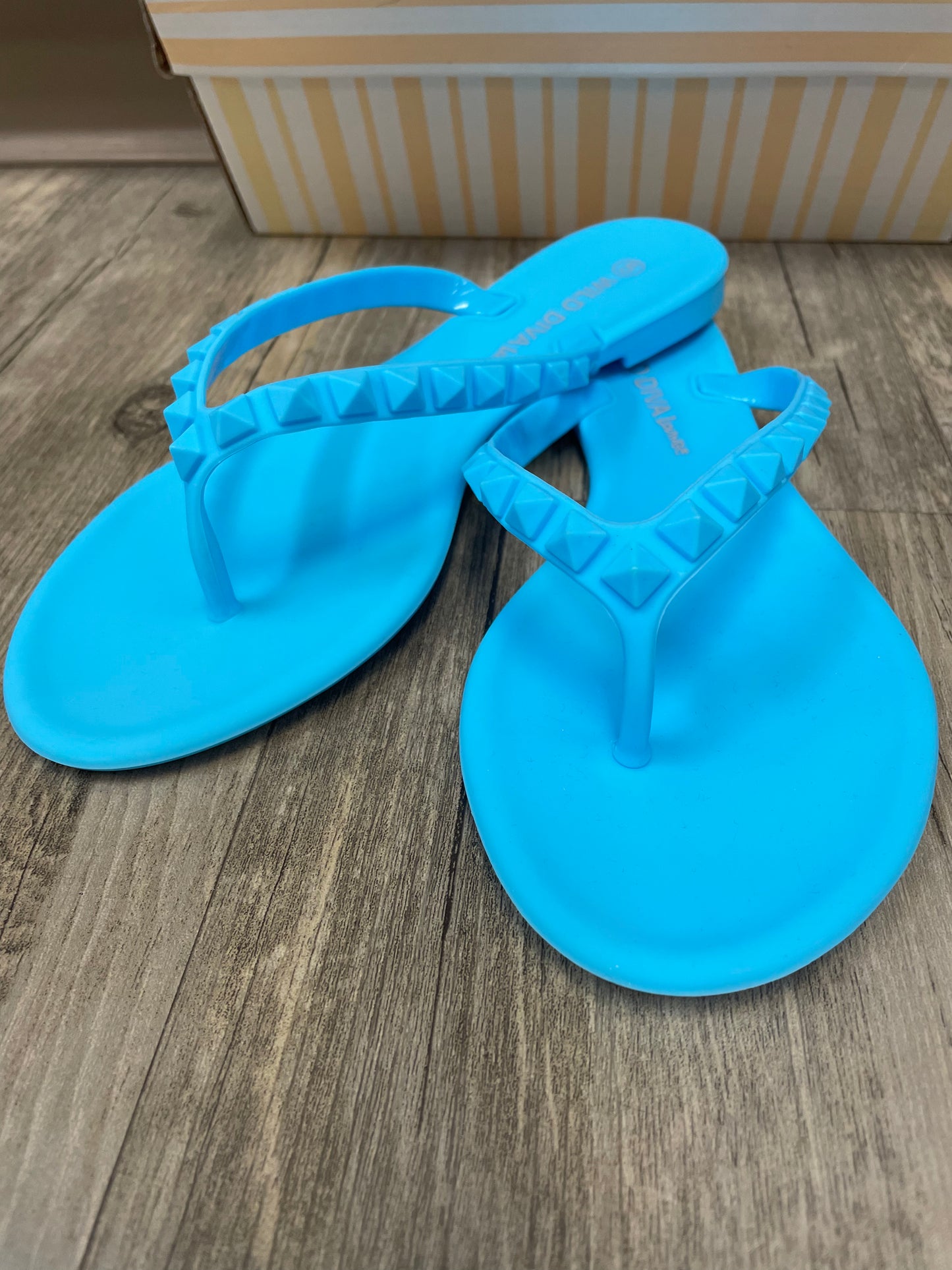 Blue studded flip flops