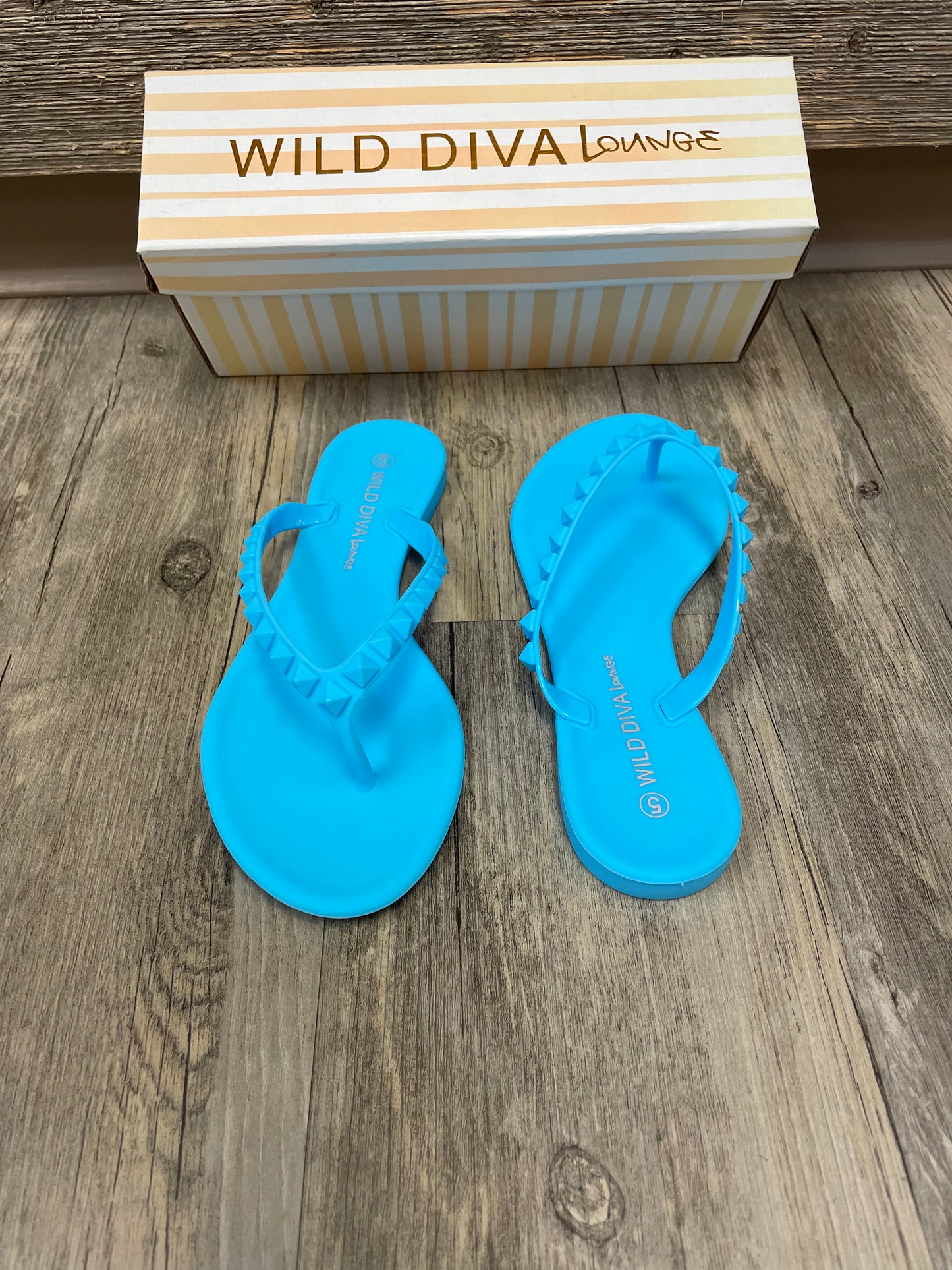 Blue studded flip flops