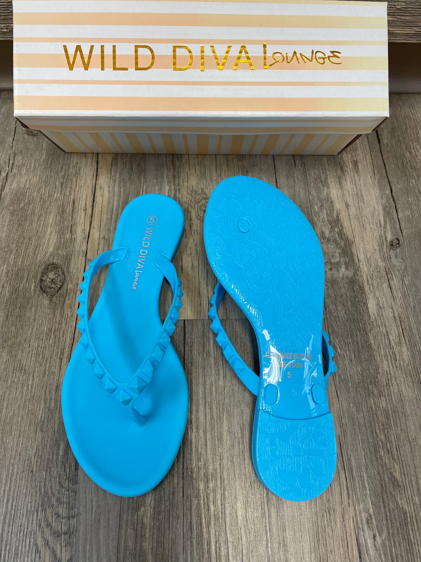 Blue studded flip flops